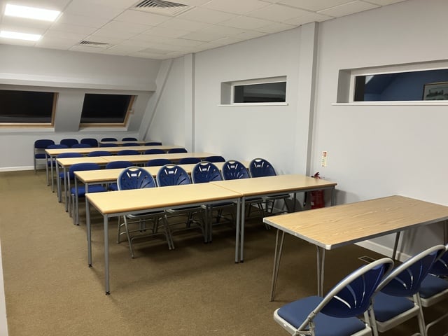 Frank Goddard Room interior, shown with tables and chairs.
